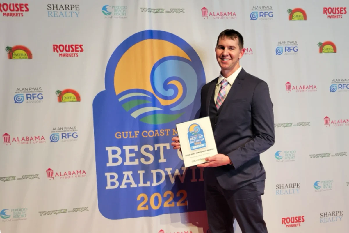 Dr Walker posing with award for Best of Baldwin 2022.
